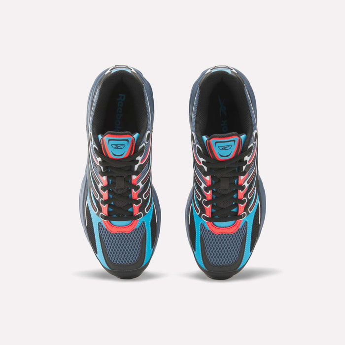 Top view of Reebok Premier Road Control Shoes, retro running style in black, blue, and red. Features mesh toe detailing, white side stripes, and black laces threaded through red and white eyelets.
