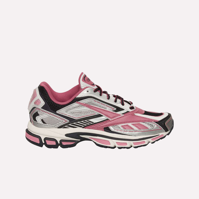 The Reebok Premier Road Ultra Shoes feature a pink, white, and black design with mesh and synthetic overlays, a lace-up closure, and a cushioned dual-density midsole for comfort.