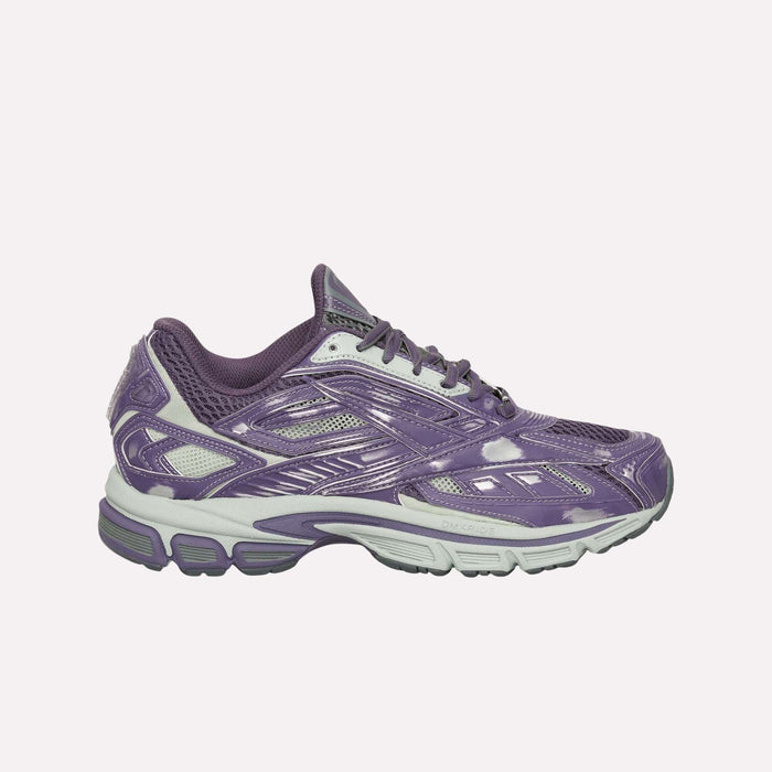 The Reebok Premier Road Ultra Shoes in purple feature white accents, mesh panels, and a thick light gray dual-density midsole, displayed in side profile against a white background.