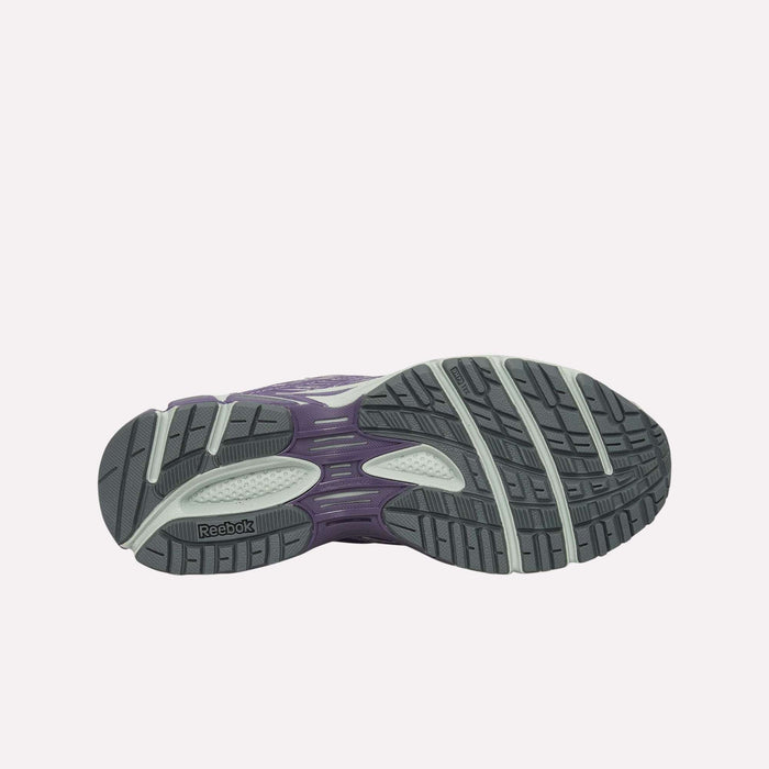 The image displays the bottom view of the Reebok Premier Road Ultra Shoes, highlighting a gray outsole with black and white traction patterns along with a purple dual-density midsole.