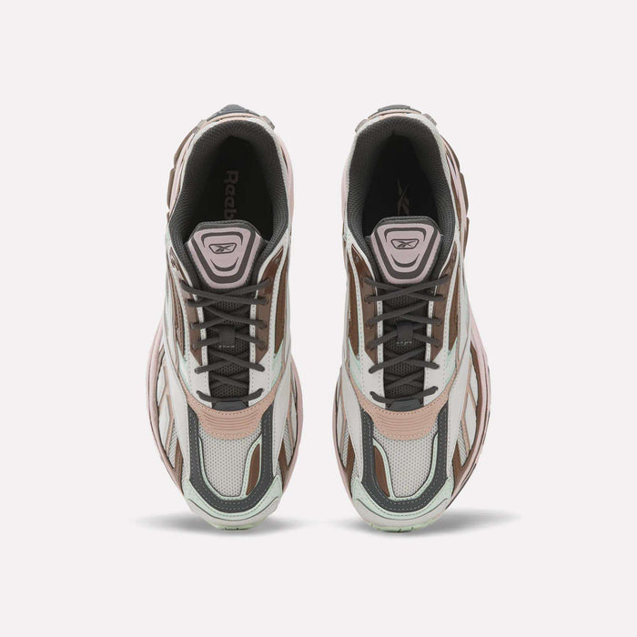 A pair of Reebok Premier Road Ultra SV Shoes viewed from above, featuring stylish white, brown, and light pink accents with black laces, mesh panels, and the iconic Reebok logo visible on the tongue—modern running shoes that pay homage to classic Y2K style.