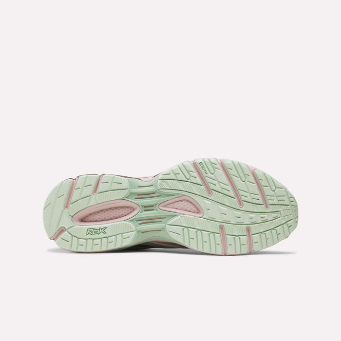 The image displays the light green and pink rubber outsole of the Reebok Premier Road Ultra SV Shoes, viewed from beneath to showcase the tread pattern and logo—an eye-catching detail inspired by Y2K footwear.