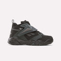 The Reebok Preseason 94 Retro Basketball Shoes, in black and dark gray with a chunky sole and mesh overlays, are shown in side profile on a white background—perfect for training sessions.