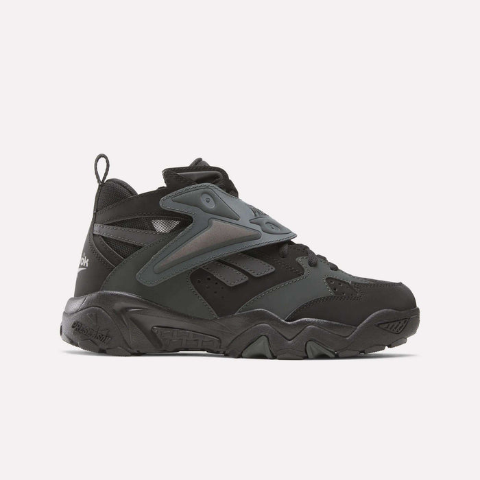 The Reebok Preseason 94 Retro Basketball Shoes, in black and dark gray with a chunky sole and mesh overlays, are shown in side profile on a white background—perfect for training sessions.