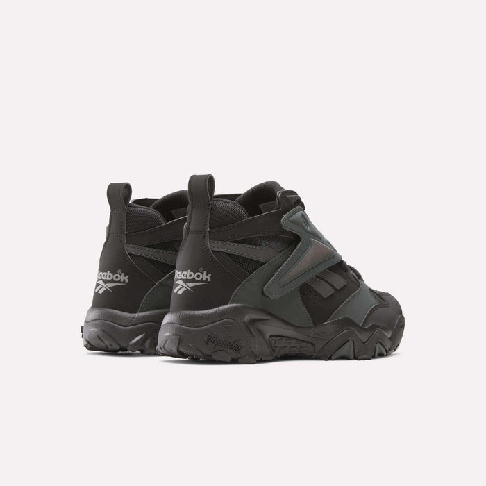 A pair of Reebok Preseason 94 Retro Basketball Shoes is shown from the back and side, featuring chunky soles, textured details, and visible Reebok logos on the heels for a classic '90s vibe.