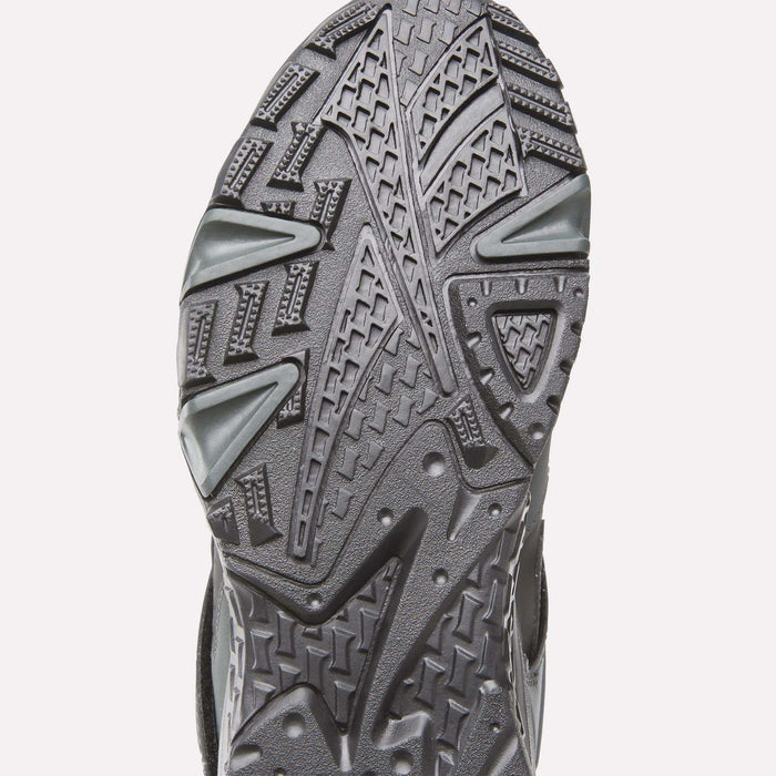 Close-up of the sole on Reebok Preseason 94 Retro Basketball Shoes, highlighting its detailed, textured tread pattern with geometric shapes and grooves designed for traction.