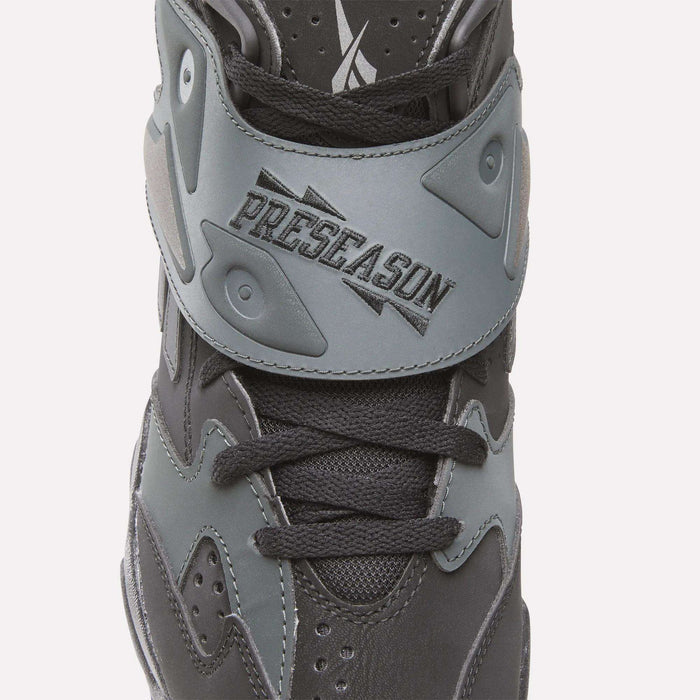 A close-up of the black and gray Reebok Preseason 94 Retro Basketball Shoes, featuring a PRESEASON strap that channels ‘90s design for standout training style.