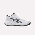 The Reebok Press Basketball Shoes are white athletic sneakers with black accents, a mesh upper, white laces, black tongue, Reebok side logo, and a thick white sole with black bottom—reflecting classic Reebok basketball style.