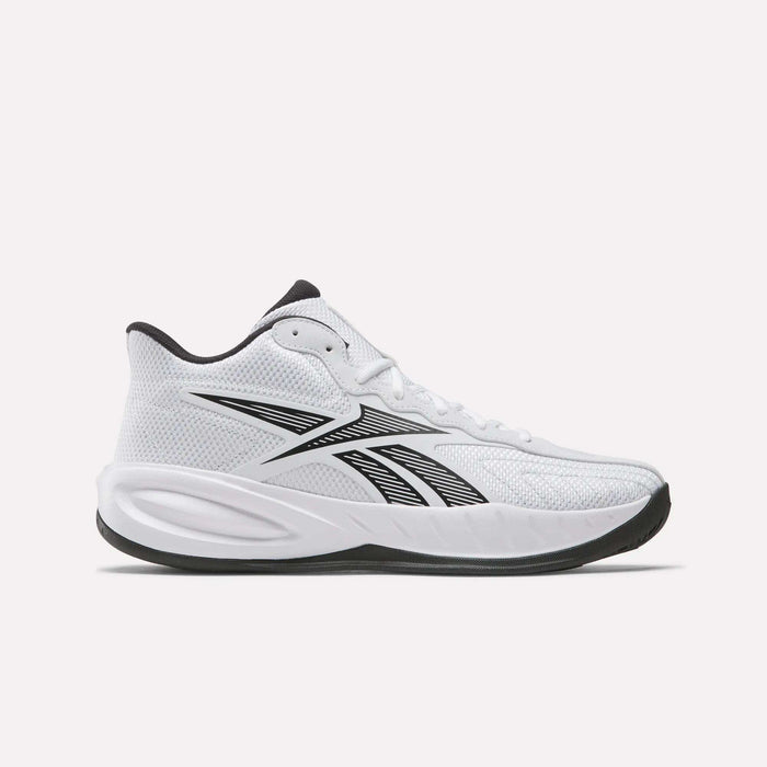 The Reebok Press Basketball Shoes are white athletic sneakers with black accents, a mesh upper, white laces, black tongue, Reebok side logo, and a thick white sole with black bottom—reflecting classic Reebok basketball style.