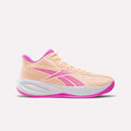 The Reebok Press Basketball Shoes feature a peach color with pink accents on the logo, sole, and lining. Designed with EVA cushioning for extra comfort, this stylish athletic sneaker is displayed on a plain white background.