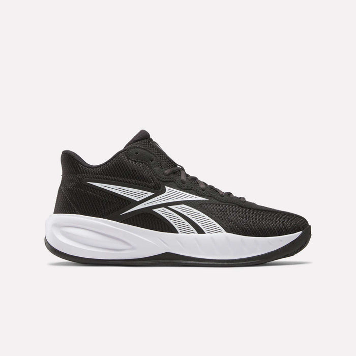 The Reebok Press Basketball Shoes are black sneakers with white accents, a thick white sole, and the Reebok logo on the side. Lightweight mesh upper and EVA cushioning deliver responsive all-day comfort for court or casual wear.