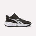 The Reebok Press Basketball Shoes are black sneakers with white accents, a thick white sole, and the Reebok logo on the side. Lightweight mesh upper and EVA cushioning deliver responsive all-day comfort for court or casual wear.