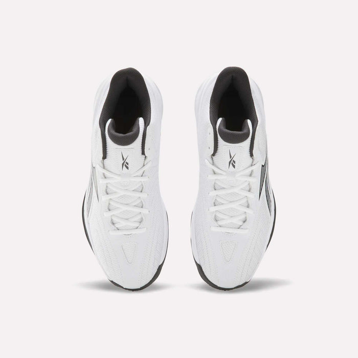 A pair of Reebok Press Basketball Shoes in white with black accents, seen from above on a white background. These sneakers feature laces, a branded tongue, and EVA cushioning inspired by classic basketball heritage.