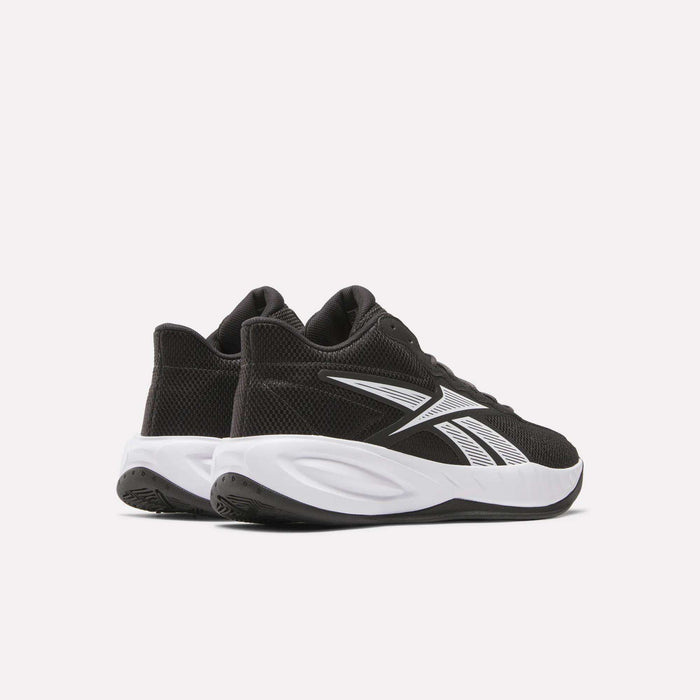 A pair of Reebok Press Basketball Shoes in black with white soles and accents, featuring the Reebok logo, displayed on a plain light background. Designed for comfort with EVA cushioning, these shoes deliver responsive athletic performance.