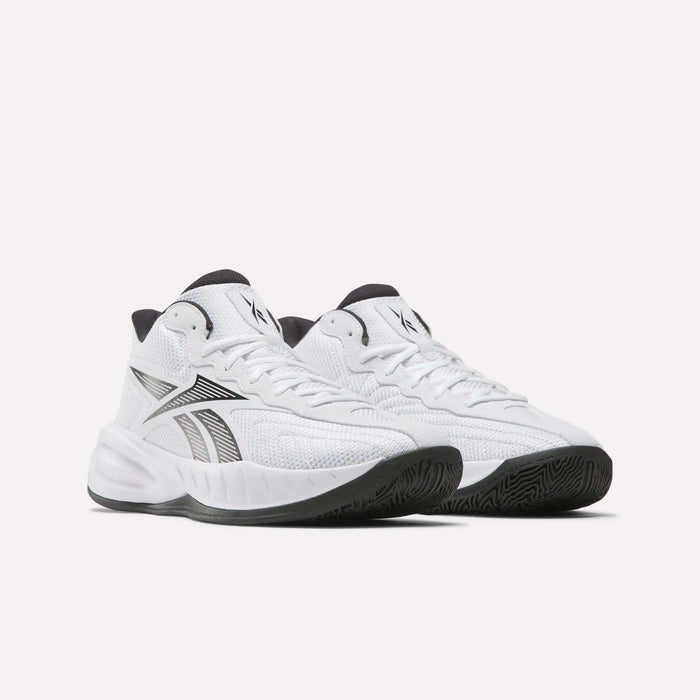 A pair of Reebok Press Basketball Shoes in white with black accents and a chunky sole, featuring the iconic side logo and EVA cushioning for comfort, are shown against a plain white background.