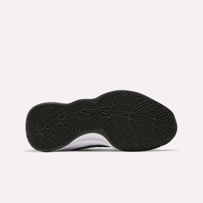 The image shows the black rubber outsole of Reebok Press Basketball Shoes, featuring a wavy, textured tread pattern, viewed from directly underneath against a plain white background.