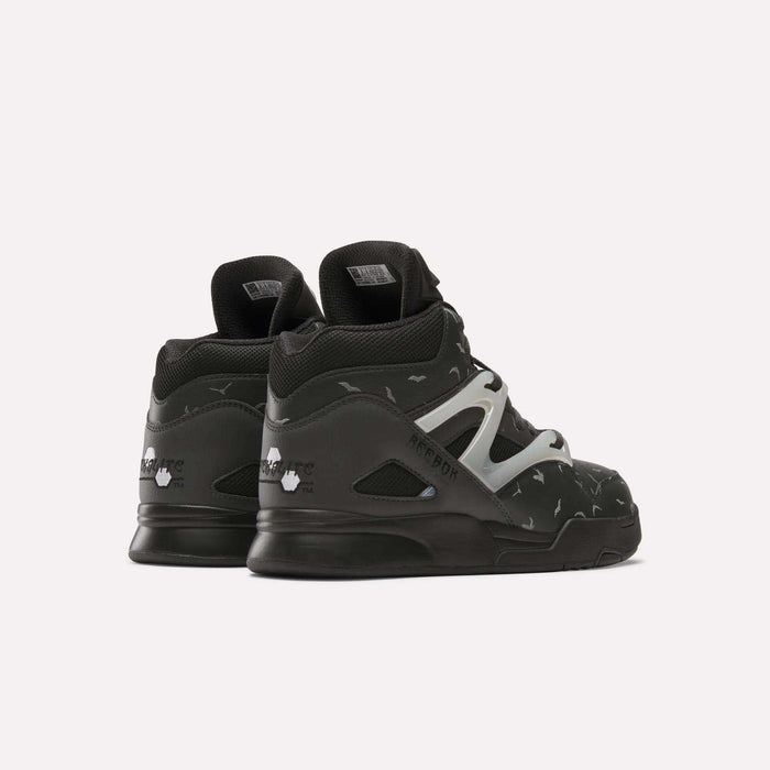 A pair of black Reebok Pump Omni Zone II Retro Basketball Shoes, high-top leather design with white side detail and small reflective accents, displayed from the back and side on a plain white background.