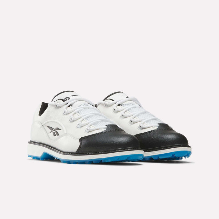 The Reebok Question Golf Shoes in white feature black toes, blue outsoles, and a side Reebok logo in a premium design, displayed on a white background.