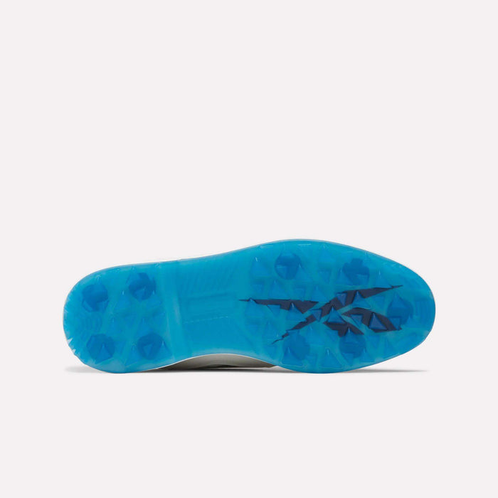 The image shows the bottom view of Reebok Question Golf Shoes with a bright blue, spikeless sole featuring multiple raised studs and a black Reebok logo in the center, showcasing their premium design.