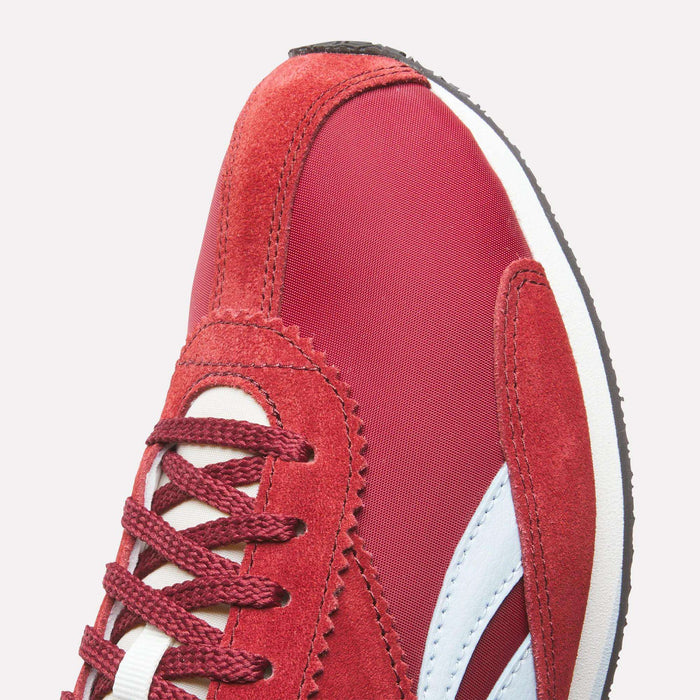 Close-up of the front section of Reebok R400 Shoes in red with white and light blue accents, featuring suede and fabric materials, red laces, and visible stitching.