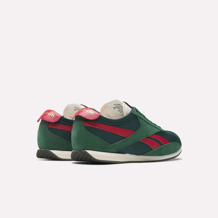 The Reebok R400 Shoes are green retro sneakers with red stripes and heel details, white midsoles, and black textured outsoles, shown against a plain light background.