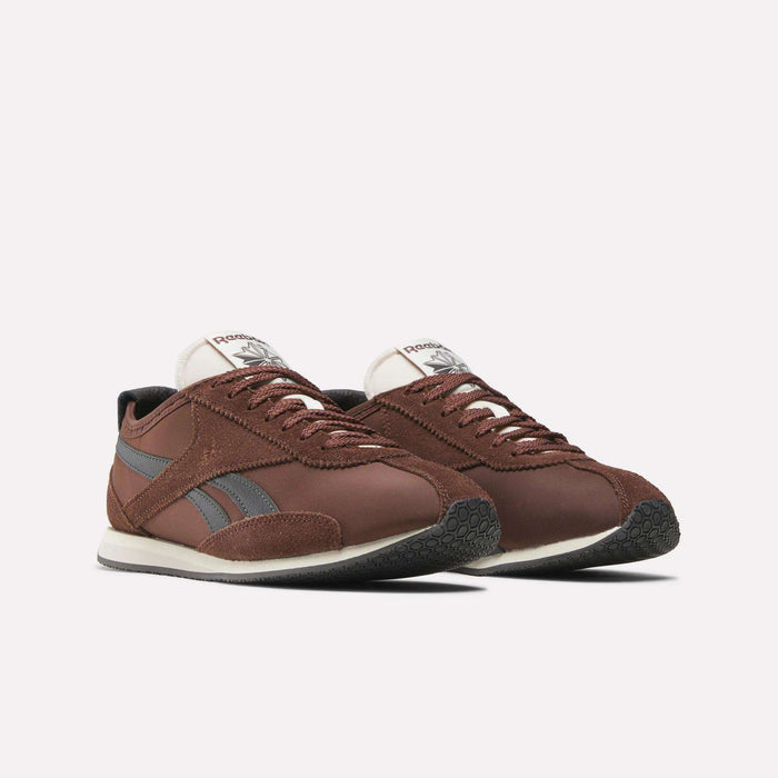 A pair of Reebok R400 Shoes in brown with gray side stripes, white soles, and black textured outsoles are displayed side by side on a plain white background.