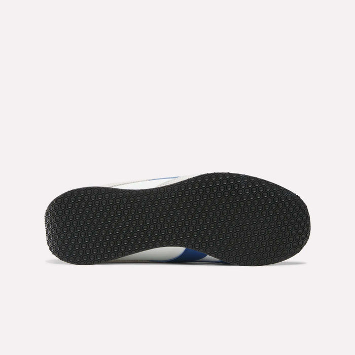 The image displays the bottom view of Reebok R400 Shoes, featuring a black textured rubber sole, set against a plain white background.