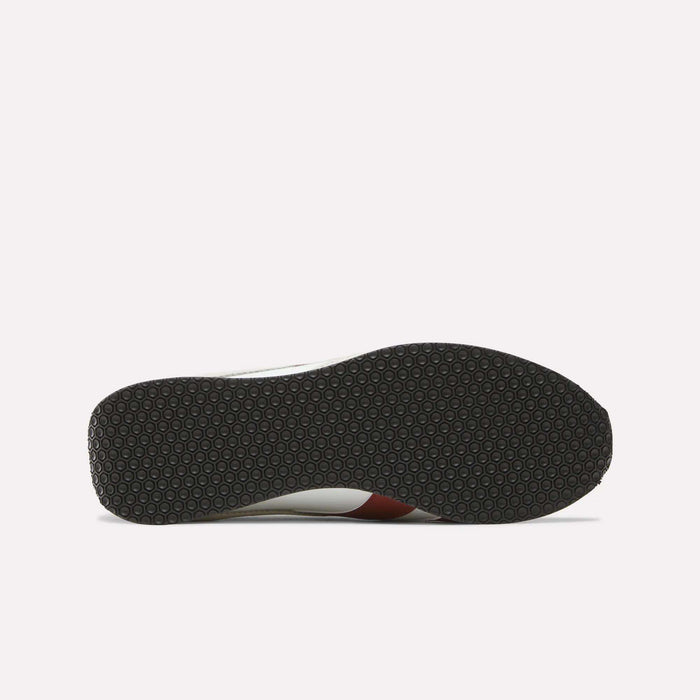 The image shows the bottom view of the Reebok R400 Shoes, featuring a black rubber sole with a repeating hexagonal pattern, a hallmark of many retro sneakers. The rest of the shoe is only partially visible from this angle.