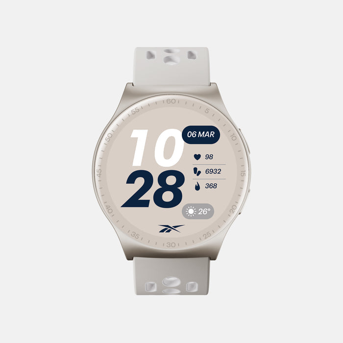 The beige Reebok Pulse Smartwatch by Reebok displays time (10:28, March 6), heart rate (98 bpm), 6932 steps, 368 calories burned, and a weather icon (26°C). Includes a light band with holes for comfort.