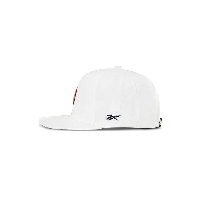 Side view of the Reebok Pump Hat, a white flat brim cap with a small black Reebok logo embroidered on the side. Features an adjustable snap closure for a custom fit. Plain white background.