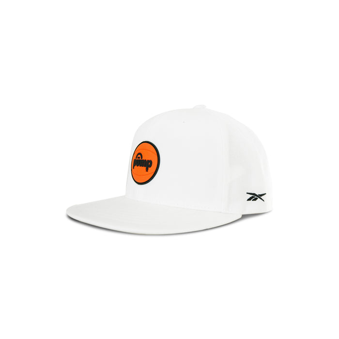 The Reebok Pump Hat by Reebok is a white cap with a flat brim, an orange circular "Pump" patch on the front, a small black Reebok logo on the side, and an adjustable snap closure for the perfect fit.