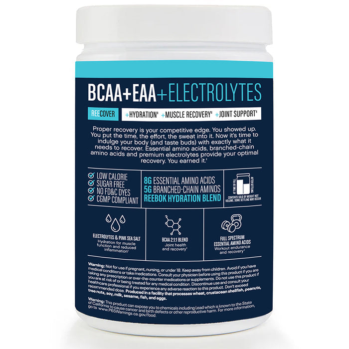 A white Reebok ReeCover BCAA + EAA + Electrolytes container features blue and black accents, highlighting hydration and muscle recovery benefits with detailed info on amino acids and electrolytes on the front.