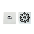 The Reebok Smart Ring Sizing Kit is shown open with eight black plastic sizers labeled 6–13. The box features the Reebok logo and SIZING KIT on the lid, ensuring easy and accurate ring fitting.