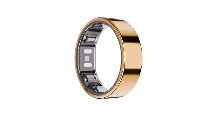 The Reebok Smart Ring by Reebok features a sleek gold finish and visible internal sensors, offering a stylish way to track your biometric data. Displayed on a plain white background, it combines advanced fitness tracking with elegant design.