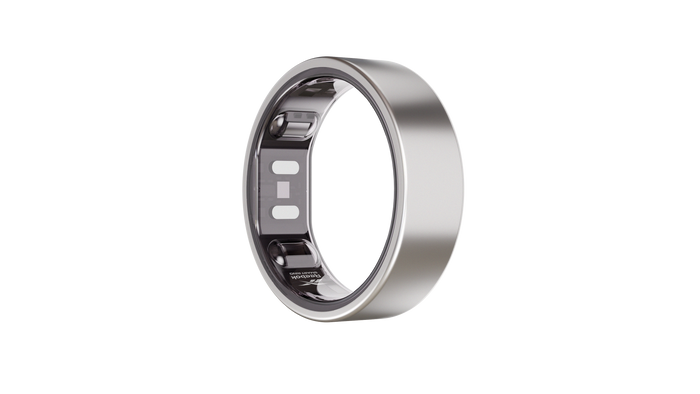 The Reebok Smart Ring, a silver wearable fitness tracker with a smooth metallic finish and visible inner sensors, is shown on a plain white background.