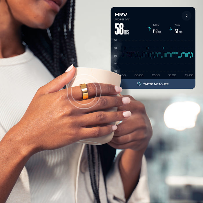 A woman with braided hair holds a cup while wearing the Reebok Smart Ring by Reebok. A digital overlay shows biometric stats: heart rate variability (avg 58 ms, max 62 ms, min 51 ms), a graph, and a measure button.