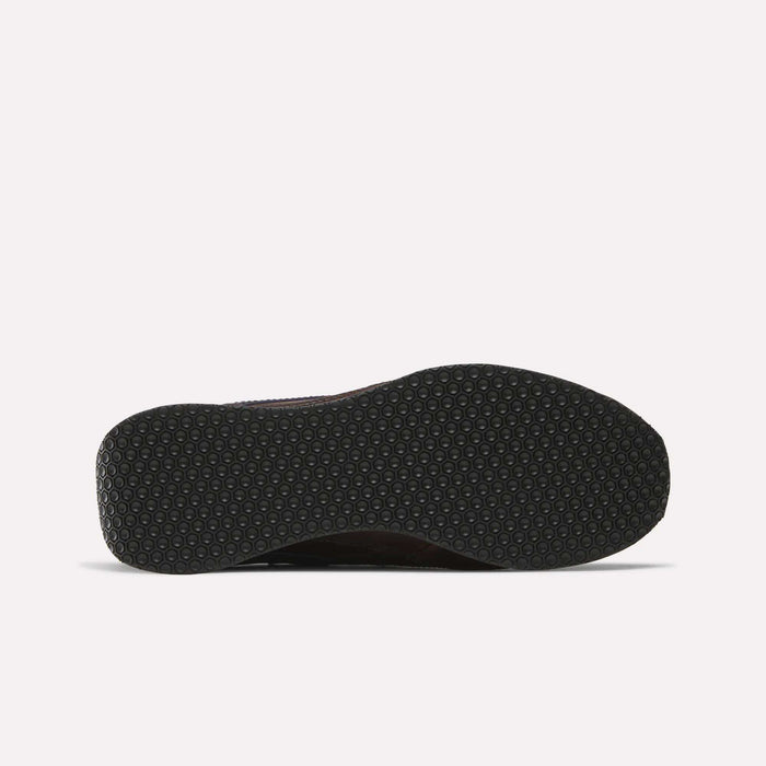 The image shows the bottom view of a Reebok Camargue x C.F. Stead Shoes sole, featuring a black hexagonal textured pattern on a white background—a durable archival style frequently combined with premium full-grain leather uppers.