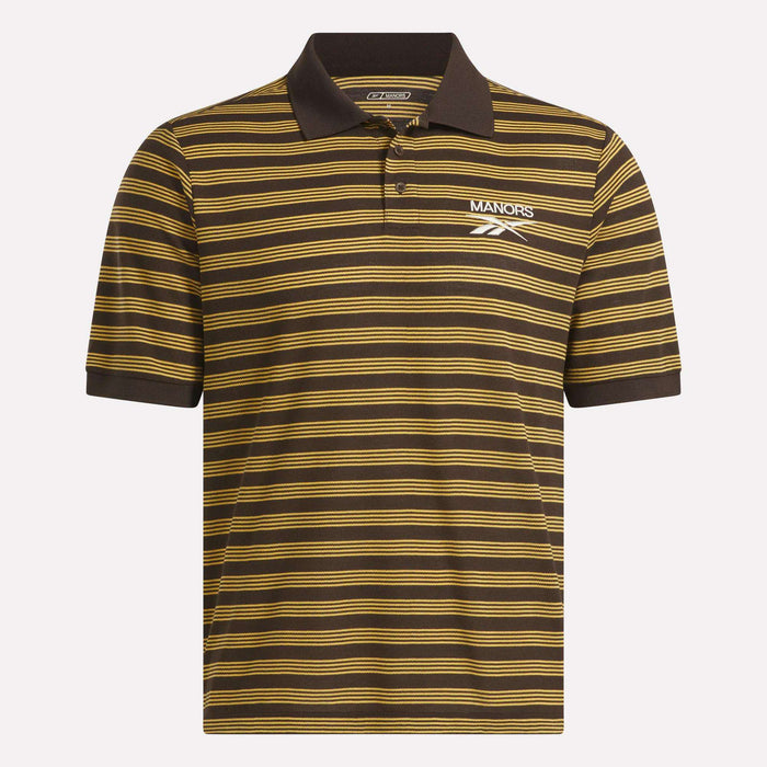 The Reebok x Manors Men’s Pique Polo is a brown short-sleeve golf shirt featuring thin horizontal yellow stripes, a classic collar, and a button placket. White MANORS and Reebok logos are displayed on the left chest, highlighting this exclusive collaboration—a stylish men’s golf polo from Reebok that’s perfect both on and off the course.