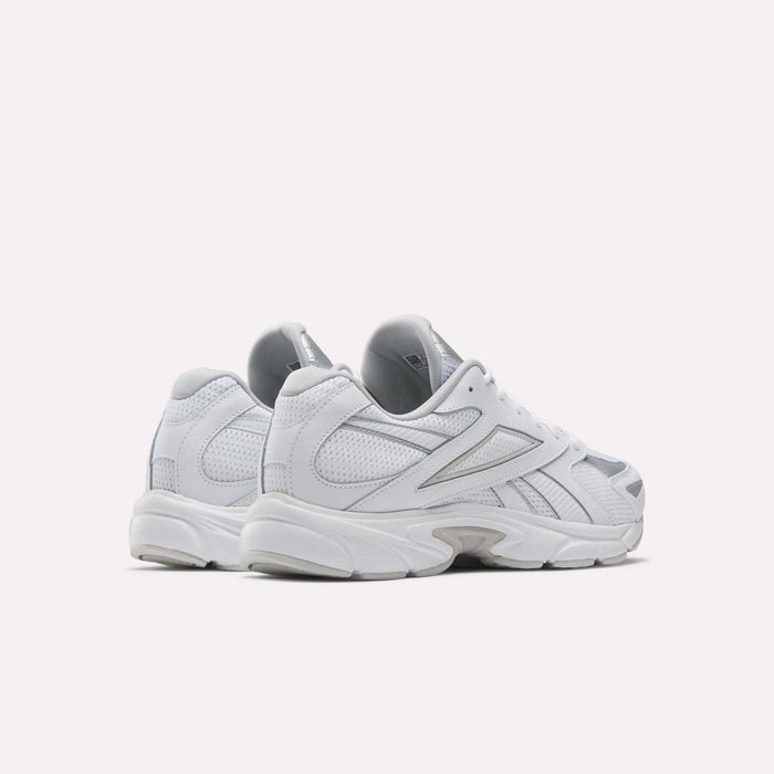 The Reebok Road Prime Shoes, shown from the back and side in white with silver accents, showcase classic Y2K running style against a plain white background.