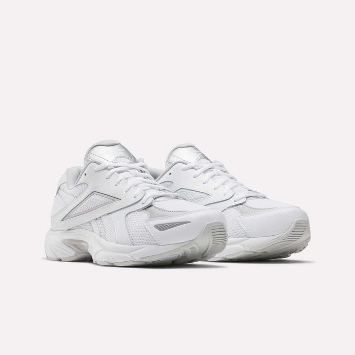 The Reebok Road Prime Shoes feature an all-white design with mesh and synthetic panels, chunky soles, and lace-up fronts in a classic Y2K running style, displayed on a plain white background.