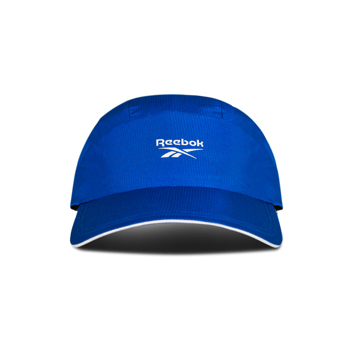 The Reebok Running Cap is a blue sports visor with a curved brim and white Reebok logo on the front, shown on a white background with a shadow. This lightweight cap offers comfort and moisture-wicking performance for runners.