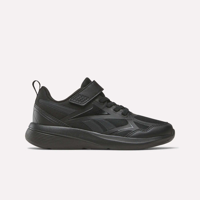 The Reebok Rush Runner 6.0 Elastic Lace Top Strap Running Shoes for little kids in Black/Black/Black feature a mesh and synthetic upper, hook-and-loop strap, and textured rubber sole for all-day comfort, shown in side profile on a white background.