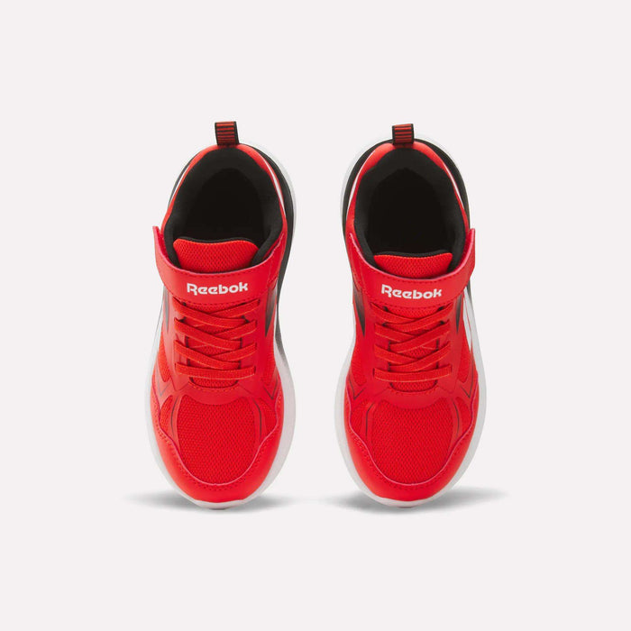 A pair of Reebok Rush Runner 6.0 Elastic Lace Top Strap Running Shoes for little kids, shown from above on a white background. The bright red shoes feature white soles, red laces, and the Reebok logo on the tongue.