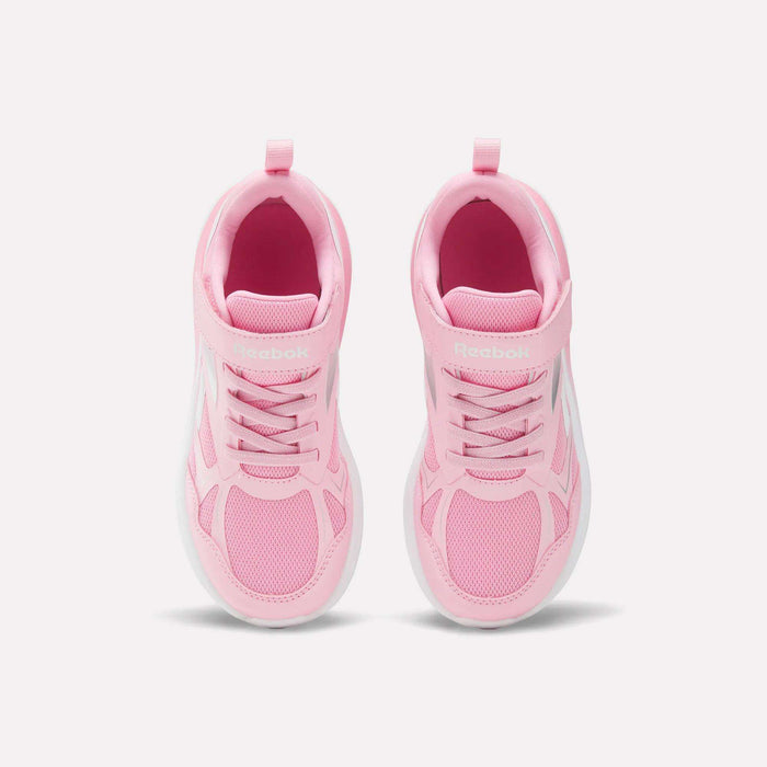 The Reebok Rush Runner 6.0 Elastic Lace Top Strap Running Shoes for little kids are pink with white soles. Shown from above against a light background, these shoes feature mesh details and laces, offering style and comfort for active girls.