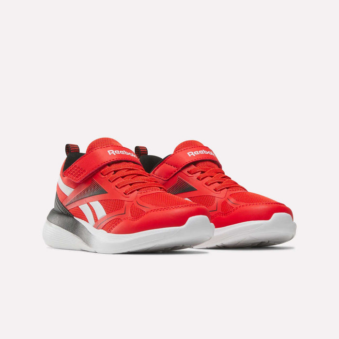 The Reebok Rush Runner 6.0 Elastic Lace Top Strap Running Shoes for little kids, in bright red with white soles, white logo accents, and black detailing, are shown on a plain white background.