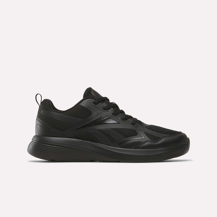 The Reebok Rush Runner 6.0 Running Shoes for big kids feature a black colorway, lace-up design, EVA midsole, textured sole, and subtle logo accents, shown against a plain light background.