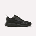 The Reebok Rush Runner 6.0 Running Shoes for big kids feature a black colorway, lace-up design, EVA midsole, textured sole, and subtle logo accents, shown against a plain light background.