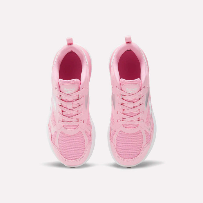 Top view of a pair of light pink Reebok Rush Runner 6.0 Running Shoes for big kids, featuring white EVA midsoles and laces, arranged side by side on a plain white background.