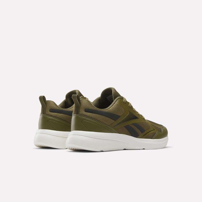 A pair of Reebok Rush Runner 6.0 Running Shoes for big kids in olive green with black accents and white EVA midsoles, displayed at an angle showing the back and side view on a plain light background.