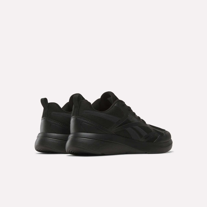 The Rush Runner 6.0 Running Shoes for big kids by Reebok are shown in black, featuring thick EVA midsoles, set against a white background and angled to display both the back and side views.